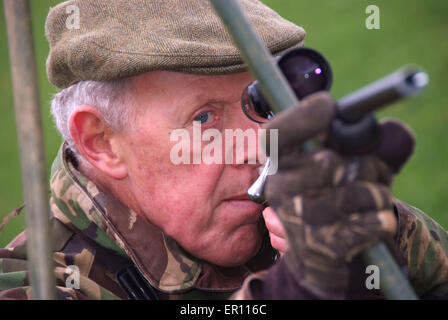 Duff Hart-Davis deer stalking with his gun dog and using an elevated tree platform.a UK shoot shooting'blood sports'venison Stock Photo