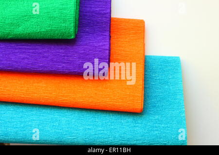 on a white background rolls of colored paper Stock Photo