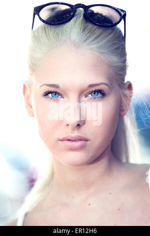 Attractive and cute blonde teen face portrait Stock Photo