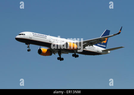 Commercial aviation and air travel. Icelandair Boeing 757 jet plane flying on approach.