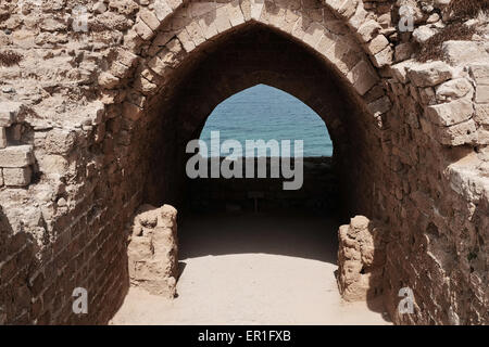 Apollonia National Park, Israel. 24th May, 2015. The Crusader Fortress Arsouf (as named under Crusader rule) was protected by a dry moat and entry was through a wooden bridge. Apollonia National Park, named after the god Apollo, is located on a cliff named Tel Arshaf overlooking the Mediterranean, north of Tel-Aviv. Founded by the Phoenicians in the Persian Period (6th century BCE) it was conquered from the Muslims by the Crusaders in 1191 CE. The fortress was built in 1241 CE dominating the harbor. The Crusader city was walled and surrounded by a moat. Credit:  Nir Alon/Alamy Live News Stock Photo