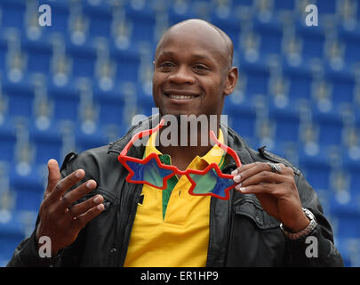 Jamaican Asafa Powell speaks to the media at Melbourne Park in ...