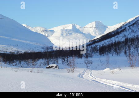 Snow covered mountains and trees, Dapmotjavri, Norway Stock Photo