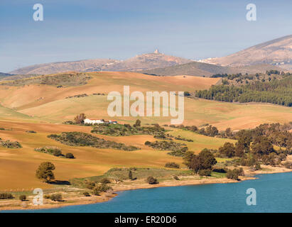 Malaga Province, Andalusia, southern Spain.  View across Conde de Guadalhorce dam to farmhouse. Stock Photo