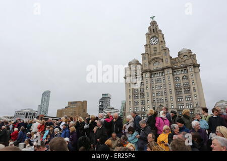 Liverpool, Merseyside, UK. 25th May, 2015. Thousands flock to Albert Dock in Liverpool to see the Three Queens event to celebrate the 175 year anniversary of Cunard as Queen Elizabeth, Queen Victoria and Queen Mary 2 sail along the Mersey and all turn in formation. Credit:  Simon Newbury/Alamy Live News Stock Photo