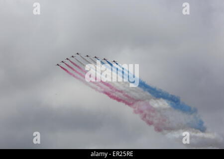 Liverpool, Merseyside, UK. 25th May, 2015. The Red Arrows fly past the Three Queens event to celebrate the 175 year anniversary of Cunard as Queen Elizabeth, Queen Victoria and Queen Mary 2 sail along the Mersey and all turn in formation. Credit:  Simon Newbury/Alamy Live News Stock Photo