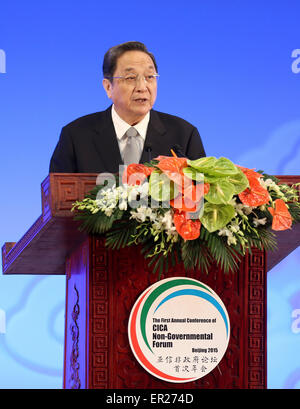 Beijing, China. 25th May, 2015. Yu Zhengsheng, chairman of the National Committee of the Chinese People's Political Consultative Conference, delivers a speech during the opening of the first annual session of the non-governmental forum of the Conference on Interaction and Confidence-Building Measures in Asia(CICA) in Beijing, capital of China, May 25, 2015. © Ma Zhancheng/Xinhua/Alamy Live News Stock Photo