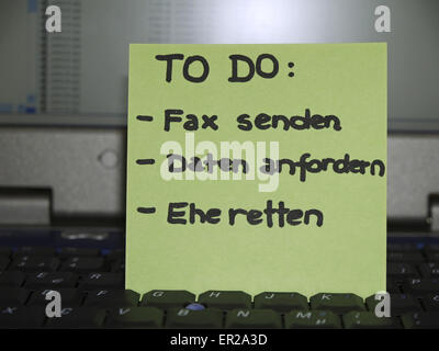 Memo note on notebook, to do send fax, get data, save marriage Stock Photo