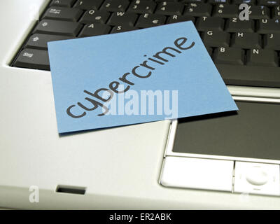 Memo note on notebook, cybercrime Stock Photo