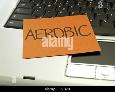 Memo note on notebook, Aerobic Stock Photo