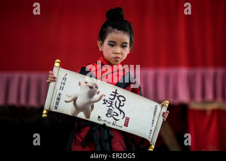 Cheung Chau Island. 25th May, 2015. A child dressed in costume waits to perform on floats ahead of the Piu Sik Parade at Bun Festival in Cheung Chau Island on May 25, 2015 in Hong Kong. One of Hong Kong's most colourful cultural celebration events, Cheung Chau Bun Festival, will be staged on 25 May 2015 until 26th May 2015 midnight. Every year, thousands of people descend upon the tiny island for The Piu Sik Parade, Lucky Bun and The Bun Scrambling Competition, the ancient custom during the festival. The tradition has been passed down for generations. Credit:  Xaume Olleros/Alamy Live News Stock Photo