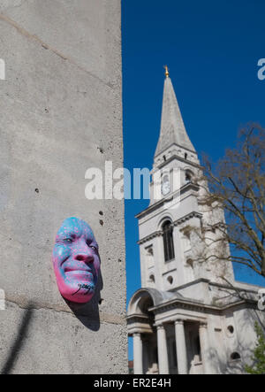 Face sculpture by French street artist Gregos with Christ Church Spitalfields in the background. Spitalfields, London, UK. Stock Photo