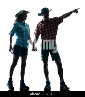 one caucasian couple trekker trekking nature pointing in silhouette isolated on white background Stock Photo