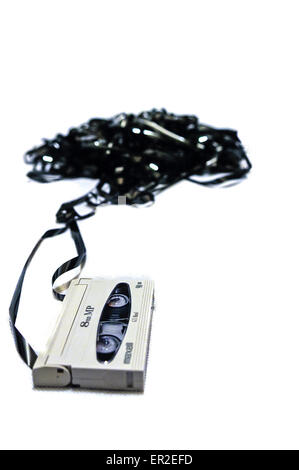 8mm video tape pulled from its cassette Stock Photo