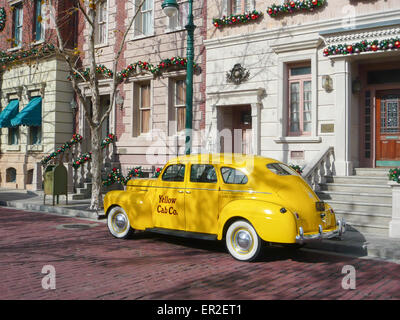 Yellow Chrysler Plymouth cab outside a house. Stock Photo