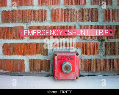 Emergency shunt trip break glass to activate a circuit breaker and disable all electrical power in a building Stock Photo