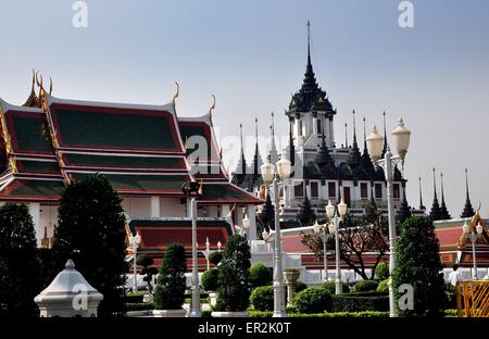Bangkok, Thailand:  Wat Ratchanadda Ubosot Sanctuary Hall st left, adjacent topiary gardens, and the Loha Prasat Stock Photo