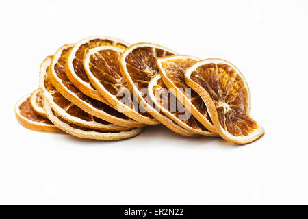Stack of dried orange slices on white background Stock Photo