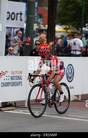 Chattanooga, Tennessee, USA.  25th May, 2015. Professional cyclist crosses the finish line in the 2015 USA Cycling National Championship Road Race (Female Pro) event, held in the streets of Chattanooga, Tennessee, USA. Credit:  TDP Photography/Alamy Live News Stock Photo