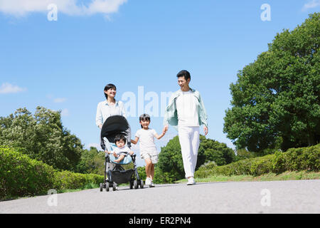 Happy Japanese family in a city park Stock Photo