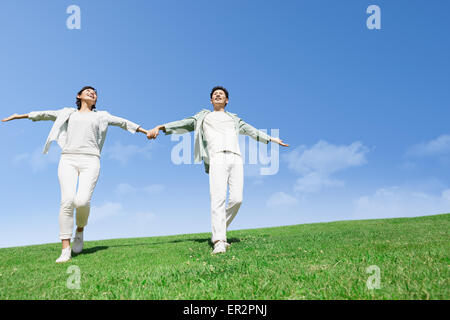 Happy Japanese couple in a park Stock Photo