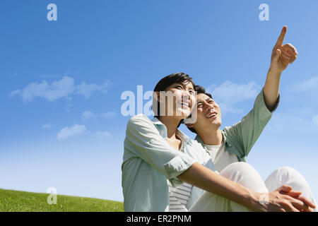 Happy Japanese couple in a park Stock Photo