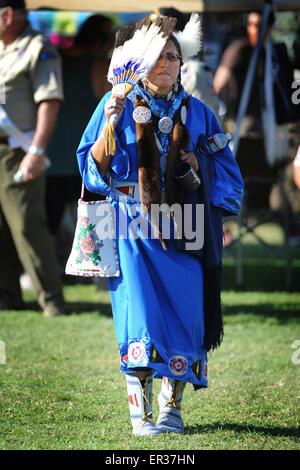 Retired United States Navy Chief Petty Officer, Linda Old Horn-Purty, a member of the Crow tribe dances the traditional American Indian Gourd Dance at the Annual Heritage Day Pow Wow November 25, 2014 in South Gate, California. Stock Photo
