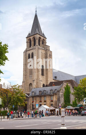 Paris, France - August 10, 2014: Abbey of Saint-Germain-des-Pres, tourists walk near popular landmark of Paris Stock Photo