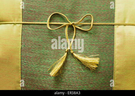 closeup of silk cushion with ribbon Stock Photo