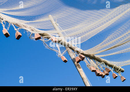 Fishing net hanging on old wall. Old wood shed.Grandfather's inheritance  Stock Photo - Alamy