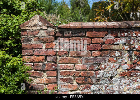 Brickwork is masonry produced by a bricklayer, using bricks and mortar. Typically, rows of bricks called courses are laid on top Stock Photo