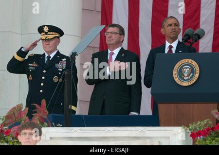 U.S. President Barack Obama stands with Secretary of Defense Ash Carter and General Martin Dempsey during Memorial Day ceremonies at Arlington National Cemetery May 25, 2015 in Arlington, Virginia. Stock Photo