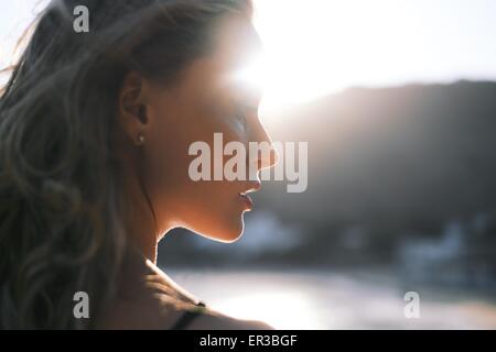 Portrait of a beautiful woman standing on beach Stock Photo