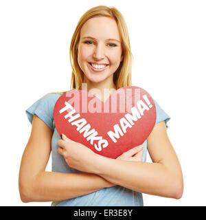 Woman holding red heart with 'Thanks Mama' text for mother's day Stock Photo