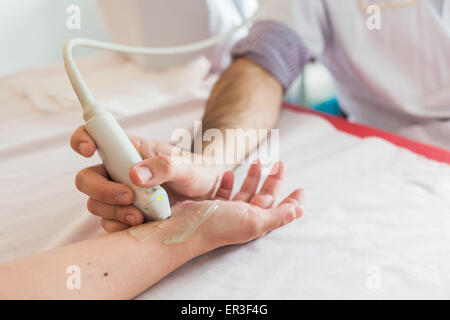 Ultrasound carpal tunnel by a rheumatologist. Stock Photo