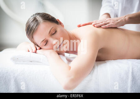 Woman receiving a back massage. Stock Photo