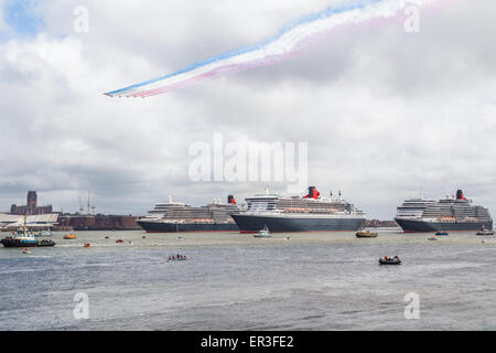 Red Arrows flying over the Three Queens in Liverpool. Stock Photo