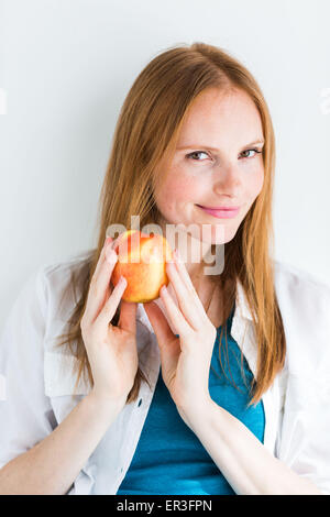 Woman eating an apple. Stock Photo