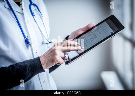 Doctor using a tablet PC. Stock Photo