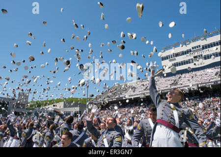 Graduating cadets from the US Military Academy class of 2015 celebrate by throwing their hats into the air during ceremonies May 23, 2015 in West Point, NY. Stock Photo