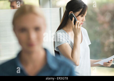 Office worker making phone call Stock Photo