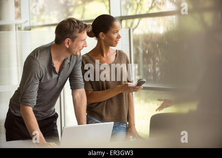 Office workers cooperating on assignment Stock Photo