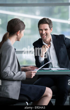 Businessman man having lighthearted meeting with client Stock Photo