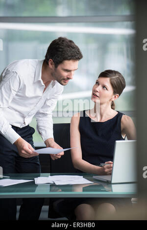 Office workers collaborating on project Stock Photo