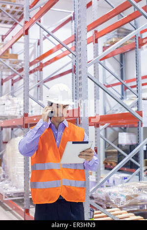 Engineer working in warehouse Stock Photo
