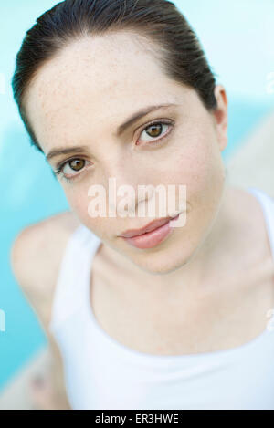 Young woman smiling with head tilted, portrait Stock Photo