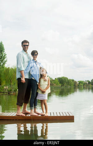 Family standing on dock, portrait Stock Photo