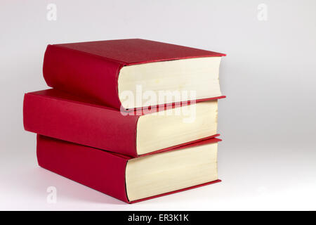 Three red books in white background Stock Photo