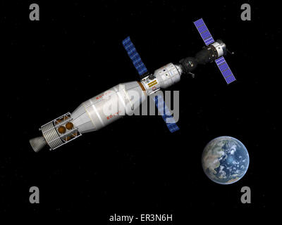 A manned Soyuz TMA-M spacecraft docked with a three-person extended stay module begins to leave Earth orbit with the aid of a Ru Stock Photo