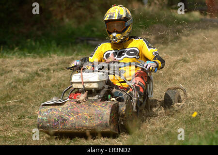 Lawnmower racing using specially tuned and adapted sit-on lawnmowers, racing around a grass circuit in Caldicot,Wales,UK.a sport Stock Photo